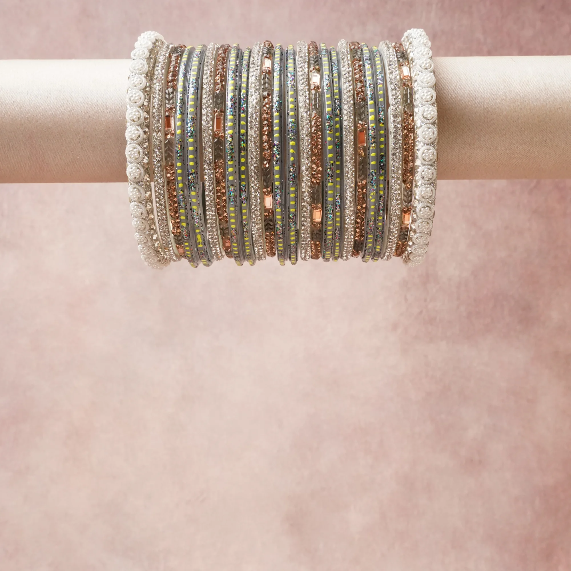 A grounding Silver forms the heart of the set, while touches of White, Clear, Rose Pink, Lime Green, Indigo add charm.

A thoughtful composition of Metal Alloy, Crystals, Glass, Faux Pearls, Enamel, designed to feel complete without being heavy.
Each element layers seamlessly, creating a look that is refined, wearable and quietly striking.